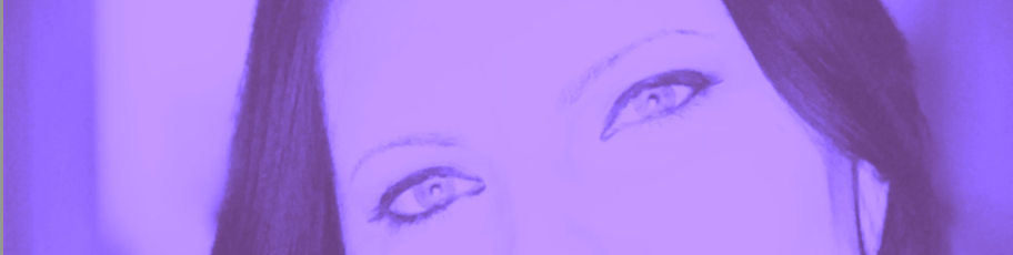 A close up shot of a woman's eyes; the photo is drenched in lavender tones and has very low contrast